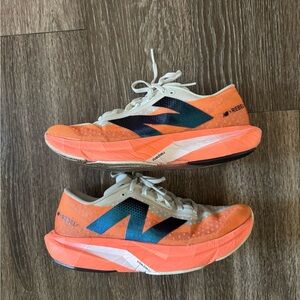 New Balance Rebel v4 Orange White Running Shoes sz 9.5